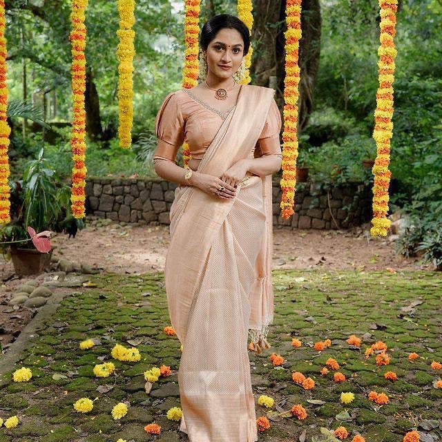 CREAM color soft silk banarasi saree with matching blouse.