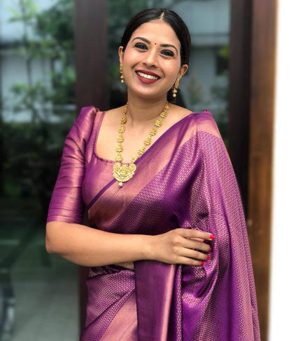 Purple color soft silk banarasi saree with matching blouse.