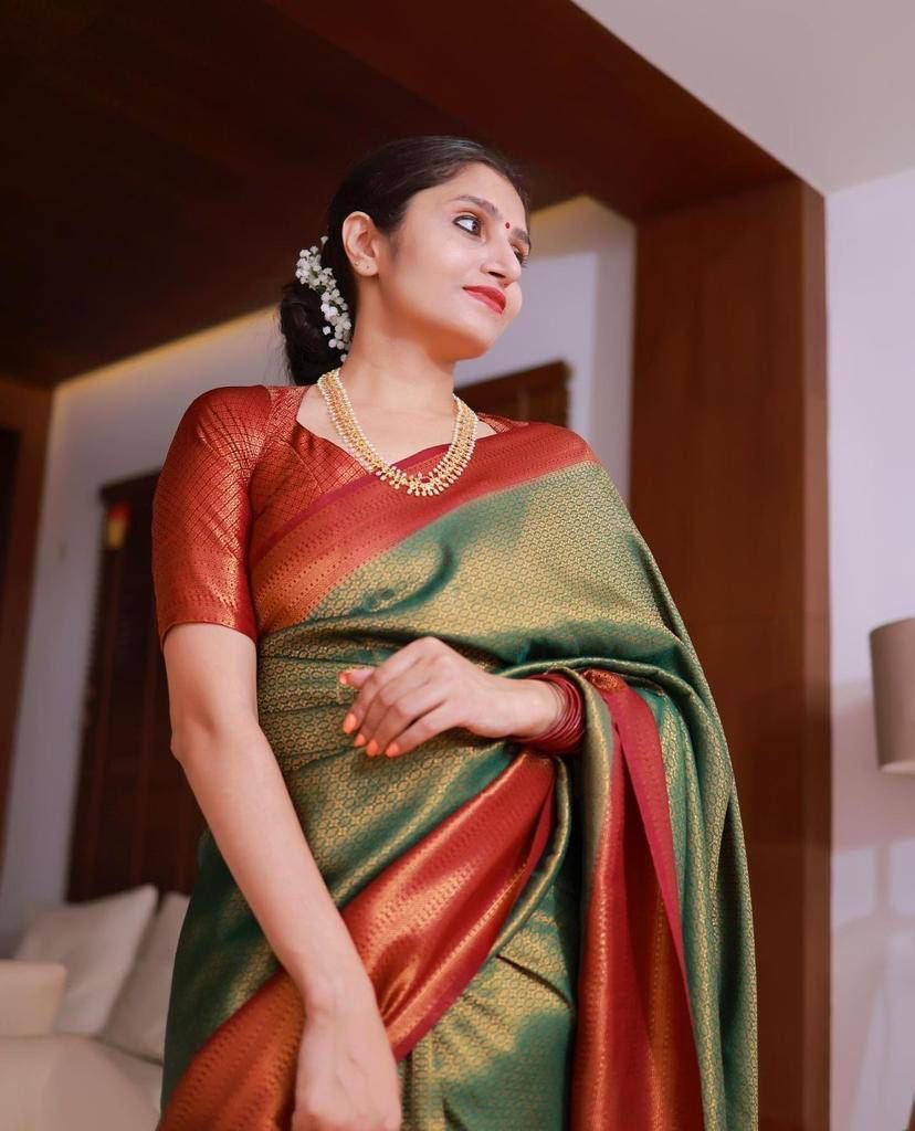 Green color soft silk banarasi saree with matching blouse.